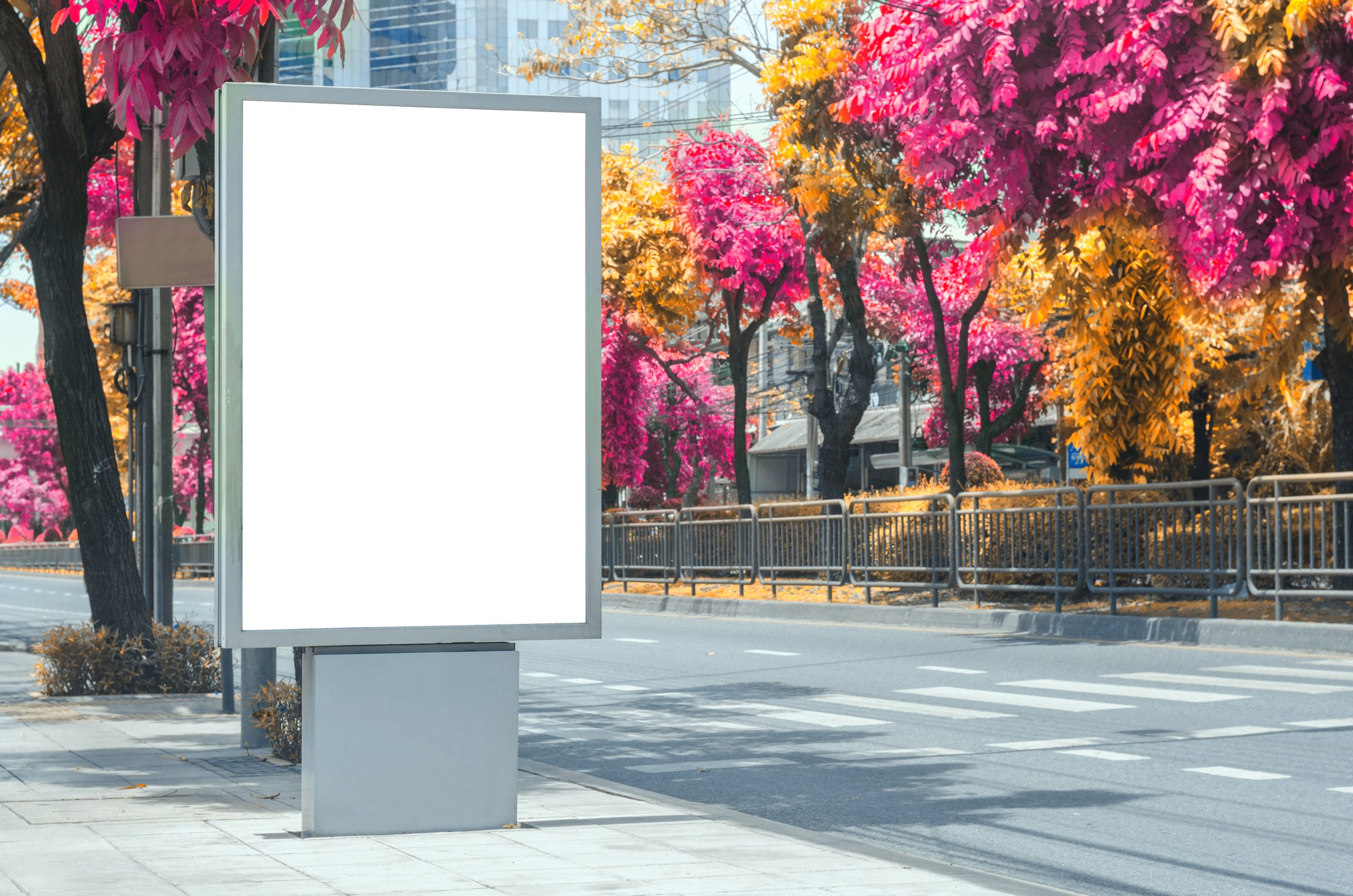 blank billboard white led screen vertical outstanding on pathway side the road. mock up board for display advertisement text template promotion new branding at outdoor with colorful autumn leaves.